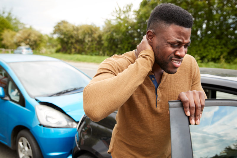 Man holding his neck after car accident - Lasky Justus Law - Your Savannah Law Firm for Personal Injury & Car Wrecks